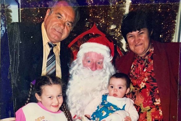 Ilias, his wife Aristea and daughters Eleni and Evagelia with Santa Claus. 