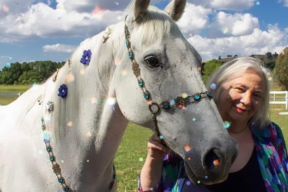 Trish with one of her beloved horses.