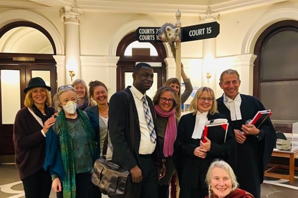 Activists from the groups Kinglake Friends of the Forest and Environmental East Gippsland celebrate their Supreme Court victory over VicForests with their legal representatives.