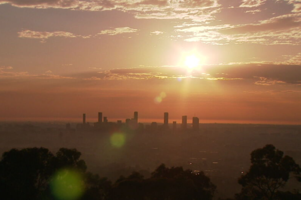 Smoke haze across Brisbane as fires burn west of the city.