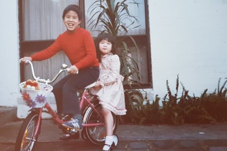 Kelly Eng and her brother as children outside their Glen Waverley home.