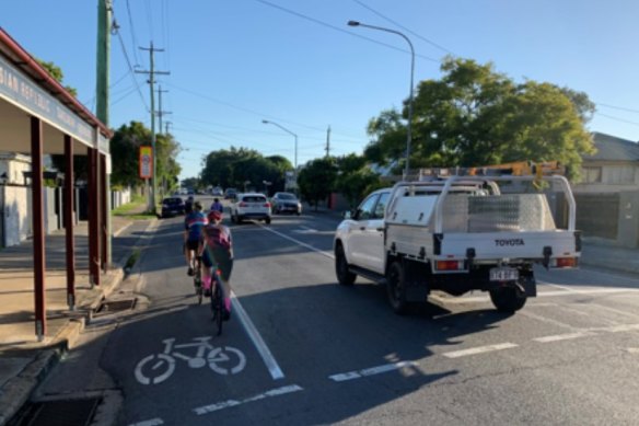 Cyclists have to go around cars parked in cycling lanes on Nudgee Road. Cyclists want this problem removed by making cycle paths separate from the road network.