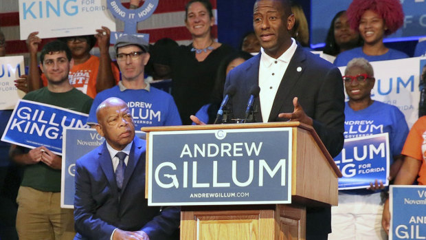Tallahassee Mayor Andrew Gillum, the Democratic nominee for the Governor of Florida, accompanied by US Representative John Lewis, left.