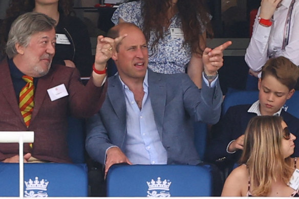 The author’s tutor of matters of cricket, Marylebone Cricket Club president Stephen Fry, in the stands with Prince William and Prince George on Saturday.
