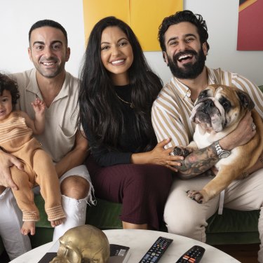 The Gogglebox crew of Jad (left), Sarah-Marie and Matty, with baby Malik and Bane the dog. 