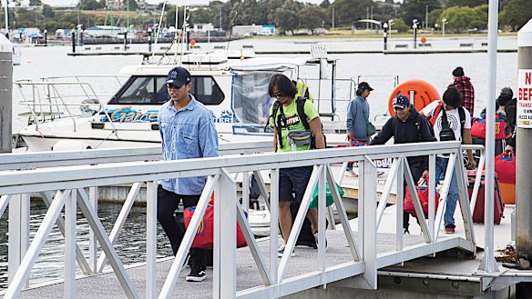 Yangtze Fortune crew members disembarking on Thursday.