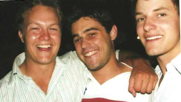 Elijah Holcombe, centre, with some friends 