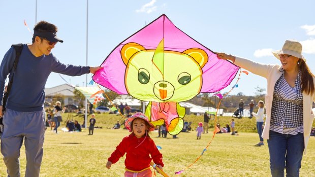 Rui Man, Cherie He, 2, and Xin He enjoy the kites at Flying High in Googong.