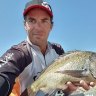 Pro fisherman fights for life after alleged Gold Coast one-punch attack