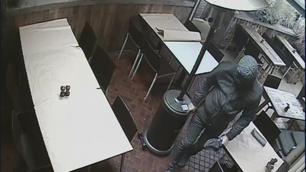 Police previously CCTV footage of a man clad head-to-toe in black.