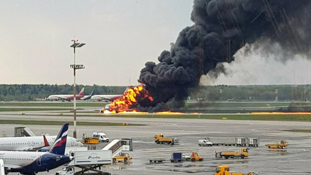 Smoke rises from a fire on a plane at Moscow's Sheremetyevo airport on Sunday.