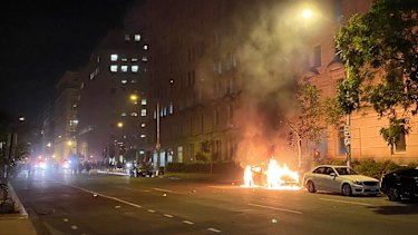 A car on fire one block from the White House as Lafayette Square protests escalate.