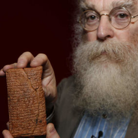 Dr Irving Finkel with the 4000-year-old cuneiform clay tablet telling the story of Noah and the Ark.