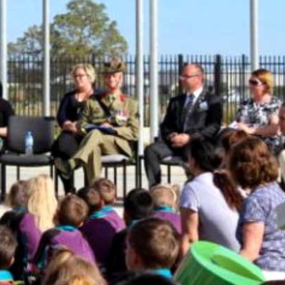 Barry Urban on Anzac Day 2017 wearing the fake medal at a school assembly.