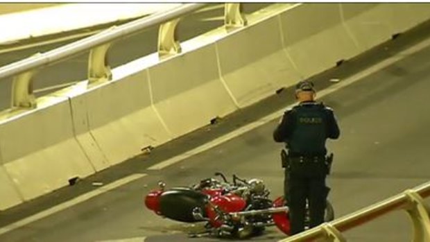 The motorcyclist was thrown from his bike into the Brisbane River.