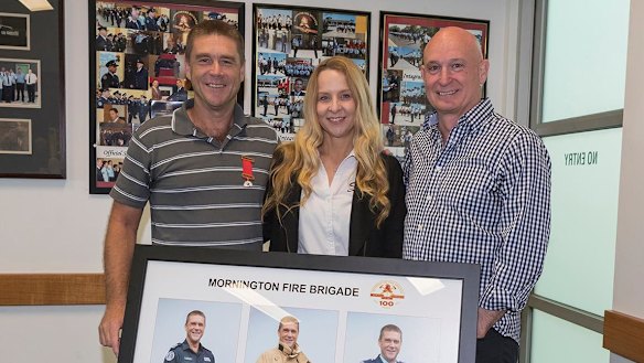 Troy Thornton with wife Christine and former Emergency Management Commissioner Craig Lapsley. 