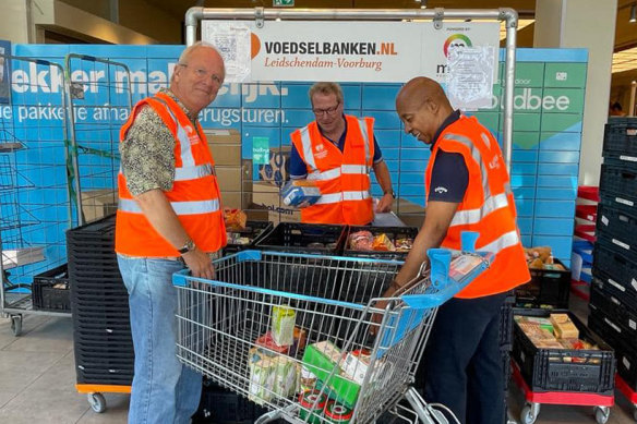 Volunteers prepare donations at the food bank in Leidschendam-Voorburg in the Netherlands, where hundreds of families rely on handouts to avoid going hungry.