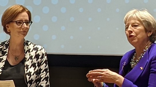 Former Australian Prime Minister Julia Gillard talks to former British Prime Minister Theresa May at The Global Institute for Women’s Leadership at King’s College London on Monday, March 7, 2022.