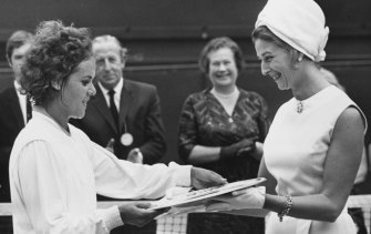 Evonne Goolagong is presented with the Venus Rosewater Dish after winning Wimbledon in 1971.