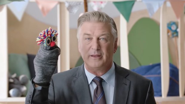 Hollywood actor Alec Baldwin, with his sock puppet, in the eToro ad.