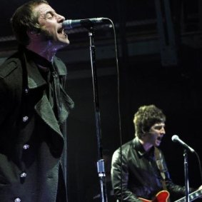 Liam and Noel Gallagher on stage together just before Oasis split in 2009.