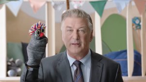 Hollywood actor Alec Baldwin, with his sock puppet, in the eToro ad
