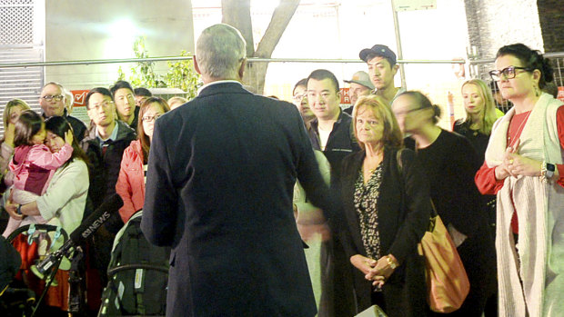 Angry home owners gathered outside  Mascot Towers apartment building.