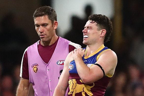 Lachie Neale leaves the field after hurting his shoulder earlier this season