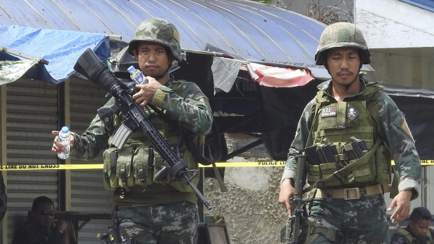 Soldiers at the scene after two bombs exploded outside a Roman Catholic cathedral in Jolo, the capital of Sulu province in southern Philippines on January 27.