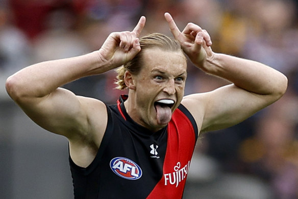 Defender Mason Redman kicked two goals for Essendon and celebrated with vigour.