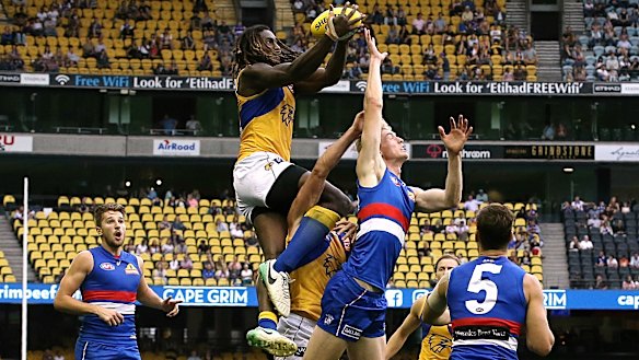 High flyer: West Coast ruckman Nic Naitanui gets up over the pack to take a grab.