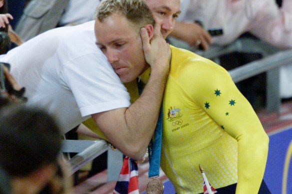 Shane Kelly is congratulated by his brother after winning bronze. 