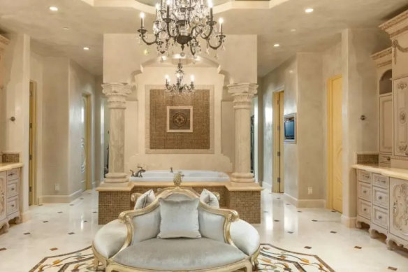 A deep spa tub in one of the nine bathrooms.  