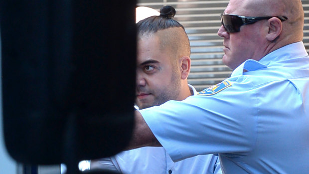 Mohammed Khazma is escorted into a transport vehicle as he leaves the NSW Supreme Court in Sydney on Tuesday.