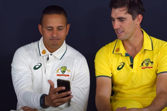 Usman Khawaja and Pat Cummins wearing the “clean” Australian shirts. 