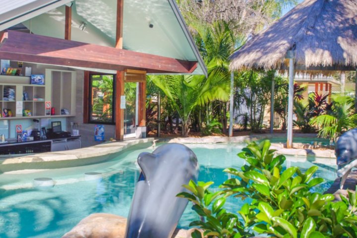 The resort includes a pool and bar.