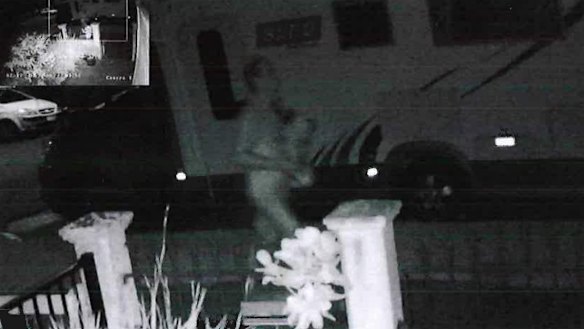 The person police believed to be Jesse Beale walking on Drury Street towards Montague Street in West End carrying unknown items. 