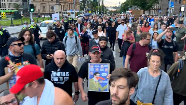 Hundreds protest in Melbourne against vaccine mandates and pandemic legislation.