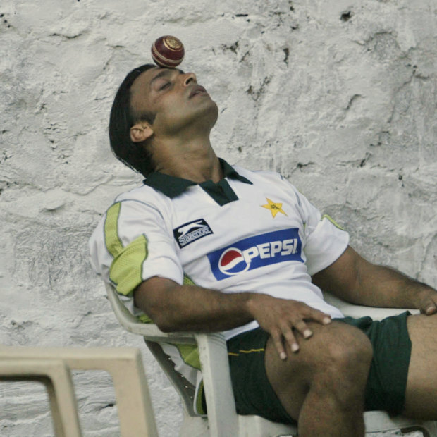 Pakistan cricketer Shoaib Akhtar tries to balance a ball on his forehead during a practice session in India in 2007. 