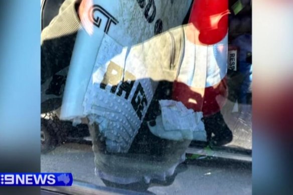 The surfboard in the back of an emergency vehicle at Port Macquarie on Tuesday.