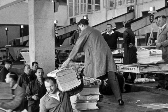 Newspapers are loaded from the presses at the Sydney Morning Herald, Broadway building in Jones Street, Ultimo in 1966.