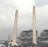 The Liddell Power Station chimney stacks being demolished today.