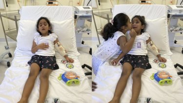 Tharnicaa and her sister Kopika in hospital on Christmas Island on June 6. 