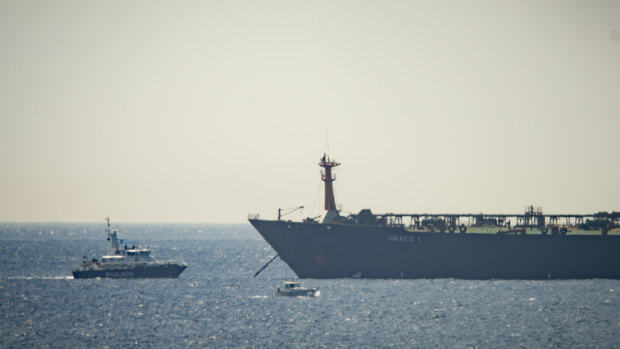 A view of the Grace 1 super tanker near a Royal Marine patrol vessel off Gibraltar.