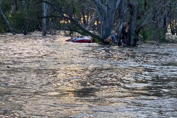 A woman aged in her 70s is lucky to be alive after she was swept away in flood waters in Elmore.