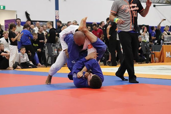 Kadek Artayana (wearing white) is blind and will compete at the Brazilian jiu jitsu world championships in California.