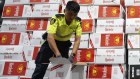 Australian Border Force officers checking illegal cigarette imports found in shipping containers in Melbourne.