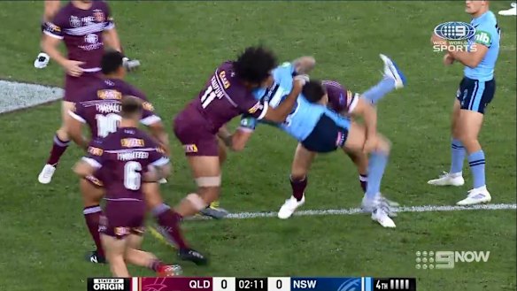 Kaufusi takes hold of Vaughan's upper body and slams him into the turf.