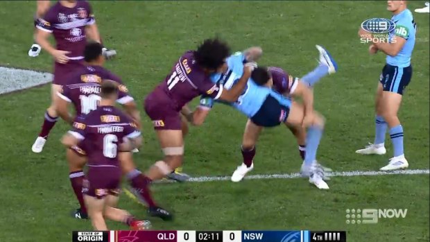 Kaufusi takes hold of Vaughan's upper body and slams him into the turf.