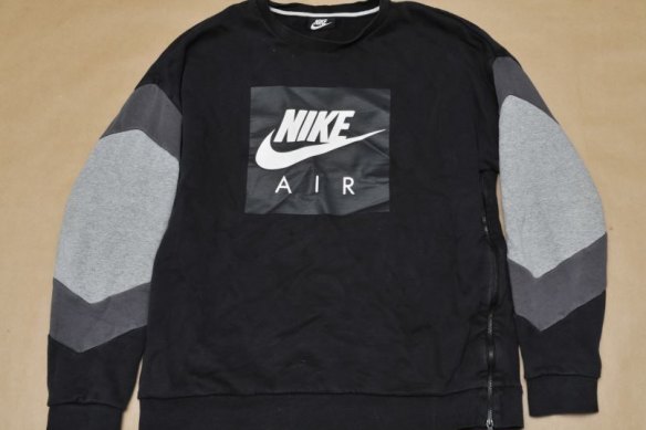 A Nike jumper that police believe was left behind in parkland by one of the offenders. 